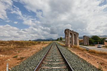 Fototapeta na wymiar train tracks with aqueduct