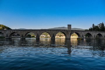 The Ottoman Mehmed Pasa Sokolovic Bridge over Drina river in Visegrad,  Bosnia and Herzegovina.