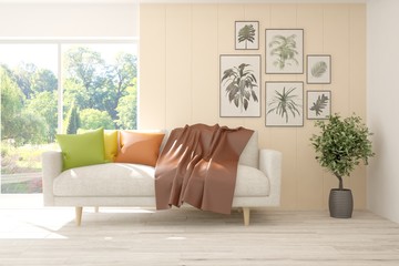 Stylish room in white color with colorful sofa and summer landscape in window. Scandinavian interior design. 3D illustration