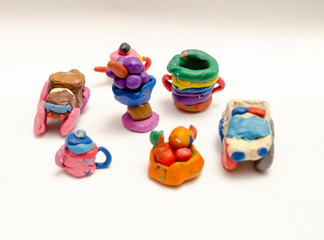 a group of colored plasticine toys