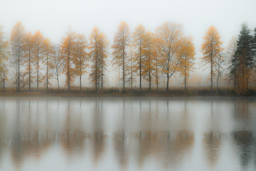 Beautiful autumn landscape of Kymijoki river waters in fog. Finland, Kymenlaakso, Kouvola