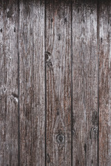Wooden background texture with knots in the wood. Vertical planks, bars