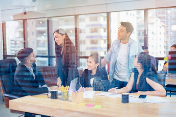 Double exposure city of Group of business people working in conference room.team of successful business people.Meeting Discussion Strategy Working Concept.