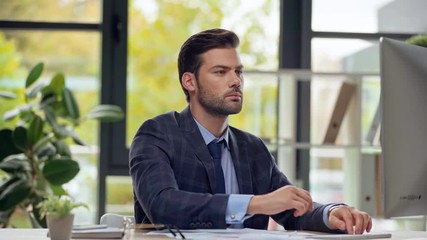 selective focus of businessman throwing papers in air 
