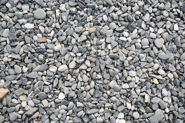 Gravel background with small and medium size stones various colors