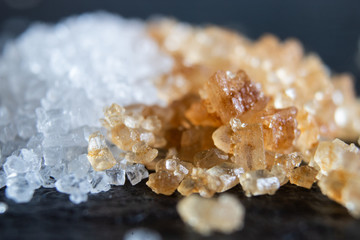 Macro of white sugar and brown sugar