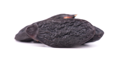 Tonka beans isolated on white background. Bean of Dipteryx odorata, cumaru or kumaru. Fresh aroma tonka beans.