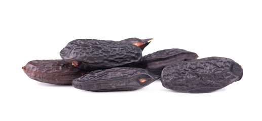 Tonka beans isolated on white background. Bean of Dipteryx odorata, cumaru or kumaru. Fresh aroma tonka beans.