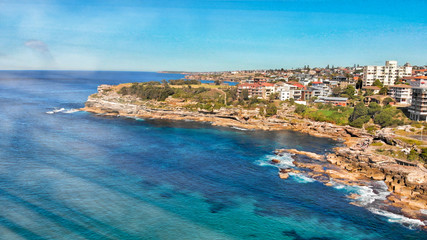 Fototapeta na wymiar Amazing aerial view of Bondi Beach landscape in Sydney, Australia. Drone viewpoint on a sunny morning
