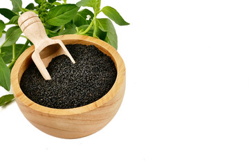 Lemon basil seeds in wooden bowl isolated on white background.food for help Reduce Cholesterol Levels For those who need to control