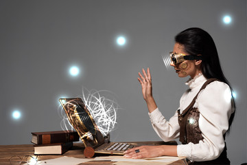 steampunk woman in goggles waving hand during video chat with glowing digital illustration isolated on grey