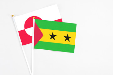 Sao Tome And Principe and Greenland stick flags on white background. High quality fabric, miniature...