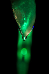 one ice cubes on a colorful background.