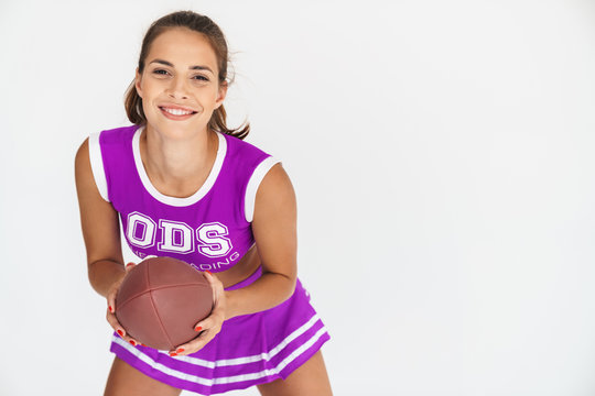 Cheerleader woman holding handball for american football.