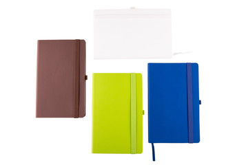 White, brown, green and blue notebooks