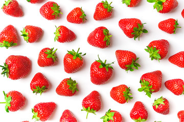 Background made from red ripe strawberry on the light background, close up shoot