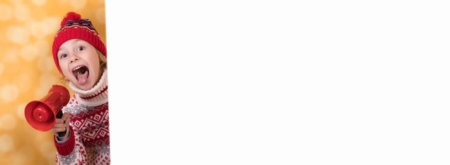 Little girl shouts something into the megaphone