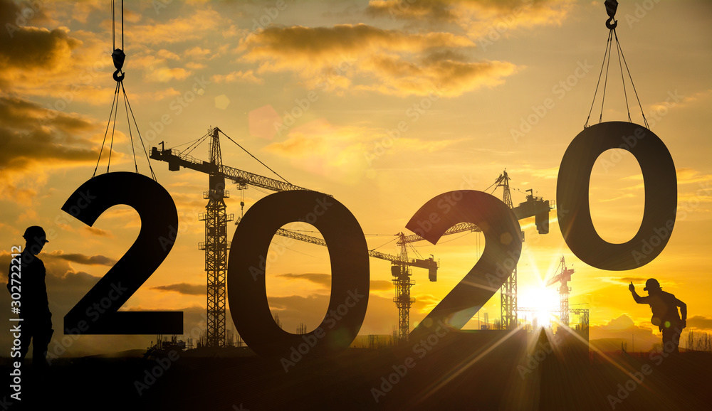 Wall mural silhouette construction site,cranes building construction 2020 year sign