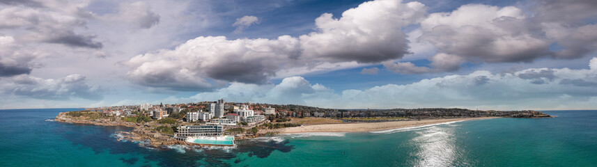 Aerial panorama of Bondi Beach pools and skyline at sunset, Australia