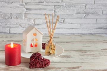 Romantic background for valentines day in red colores with candles, hearts and roses flowers.