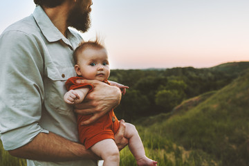 Father walking with baby outdoors family lifestyle dad and child together summer vacations...