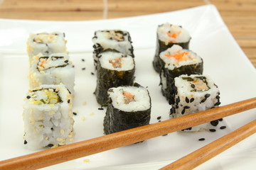 several makis on a plate