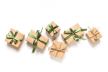 Christmas zero waste, environmentally friendly packaging. Flat lay packs gifts  kraft paper  green...