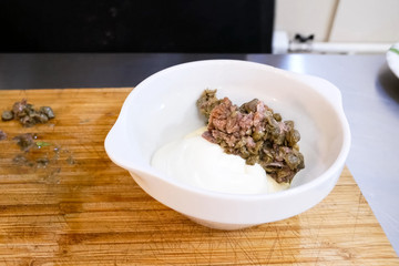 Minced meat with mushrooms in plate. Cooking.