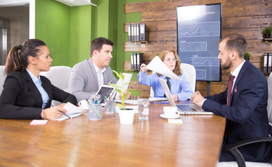 Discussion between business people in a conference room