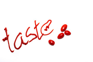 The inscription tomato ketchup on a white background, taste. Red inscription. Cooking advertising.