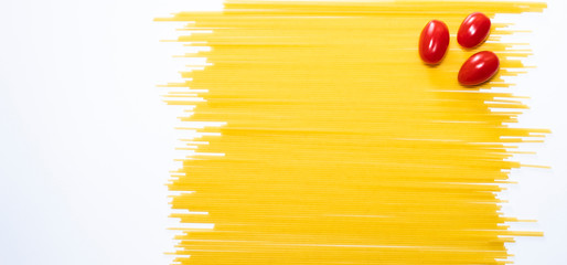 Dry spaghetti on a white background. Italian pasta. A place to copy. Food and healthy eating....