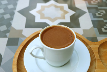 Closeup the Texture of Turkish Coffee Served on a Moorish Pattern Stone Table