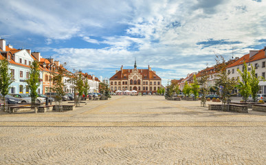 Market square in Pisz with the historic town hall, Masuria, Poland.