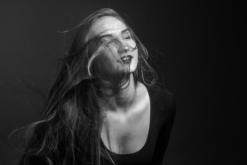 black and white portrait girl on a dark background with facial hair
