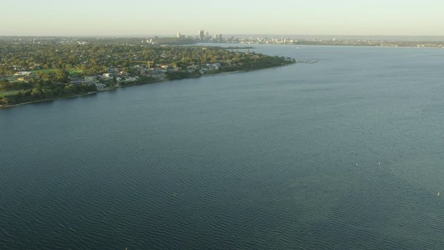Aerial sunrise view Swan River Perth city skyline