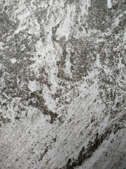 Dark gray and light gray marble pattern with black patches texture background.
