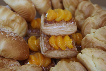 orange blast pastry at the center of vanilla cream puff