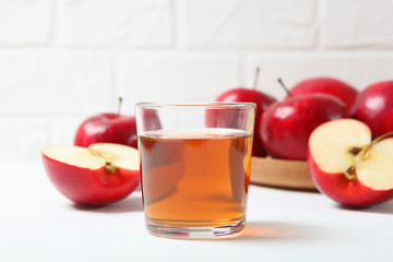 apple juice from red apples on the table.