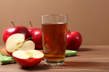 apple juice from red apples on the table.