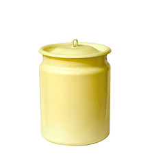 Yellow enameled can with lid isolated on white background. Old drinkware.