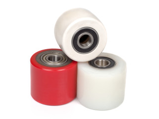 An industrial rollers for hoisting equipment made of polyamide and polyurethane isolated on a white - obrazy, fototapety, plakaty
