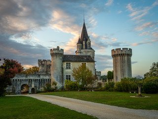 Fototapeta premium Ancient castle in southern France with dramatic evening skies and clouds