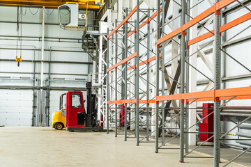 Forklift trucks in a industrial warehouse building