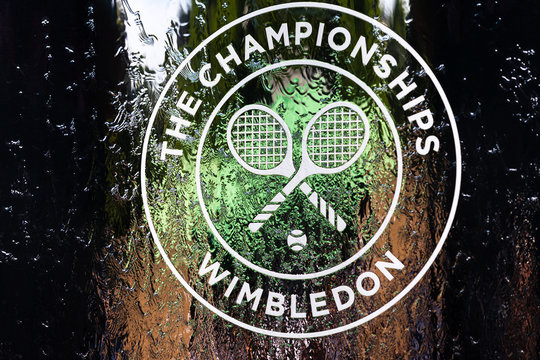 Wimbledon Tennis Open, the brand, logo of the Championships displayed on a water  wall inside the stadium