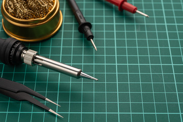 Electronics Development Concept. Hobbies are electronics. Soldering iron and tools on the desktop.