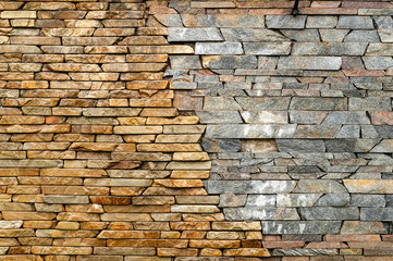Stone wall. Masonry walls made of rough stone hewn wet discord color. Stone background.