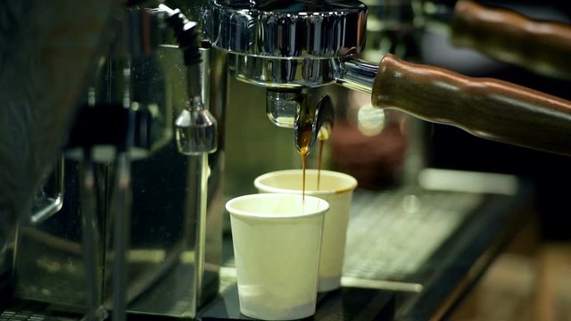 The coffee maker is put cup to machine for wait coffee liquid in coffeeshop. when start of work or workout is relax time for drink hot coffee . It can make fresh and power of life.