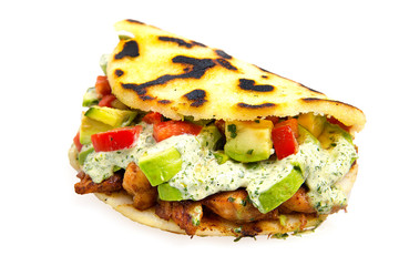 Arepas Vegan - Traditional Colombian Food originally from Latin America mixed with  vegetable and special avocado sauce. Isolated on white Background