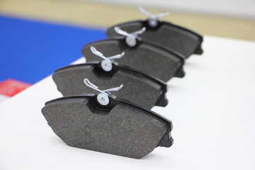 Close-up new car brake pads set for disc brakes, vehicle maintenance
