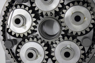 New beautiful 5 planetary gears in gear box, motion and collaboration symbol